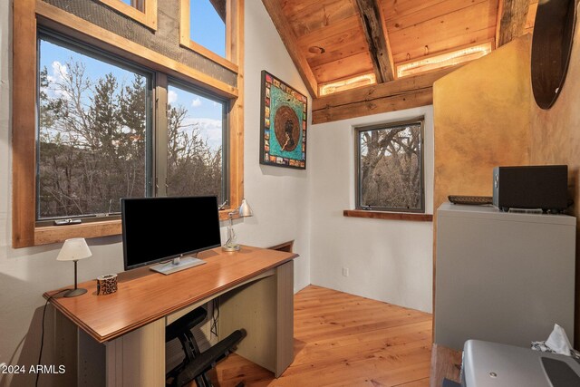 office featuring vaulted ceiling with beams, wooden ceiling, and light wood-type flooring