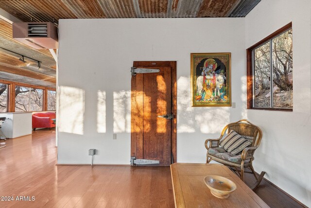 sitting room with wood-type flooring