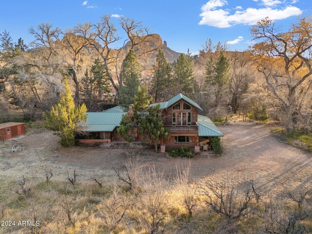 rear view of property with a mountain view