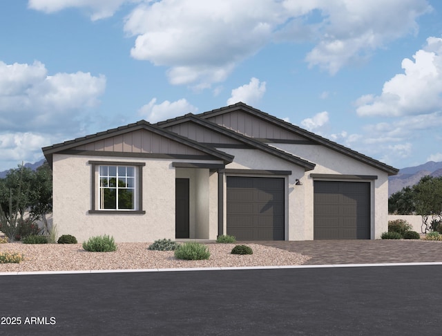 26406 N 77th Dr, Peoria, AZ 85383 - ranch-style home featuring a mountain view, an attached garage, stucco siding, and decorative driveway