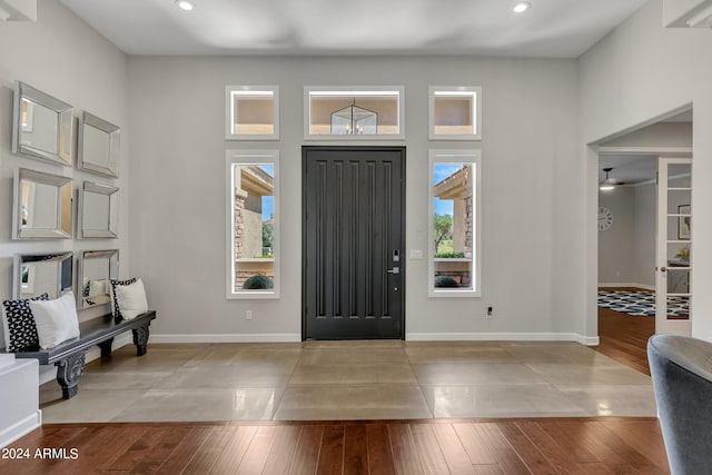 entryway featuring light hardwood / wood-style flooring, a wealth of natural light, and ceiling fan