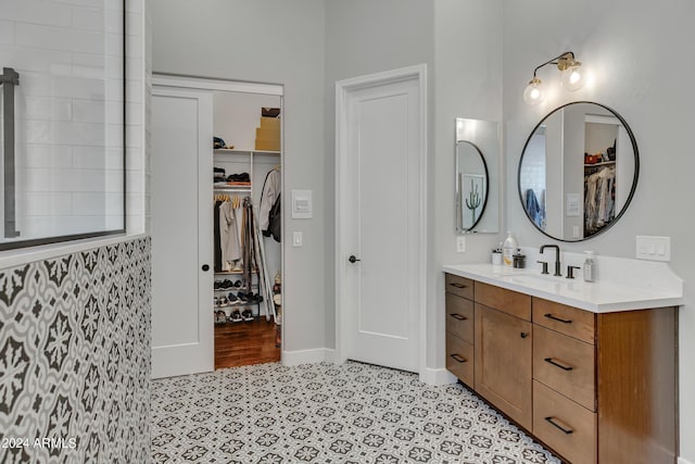 bathroom featuring tile patterned flooring and vanity