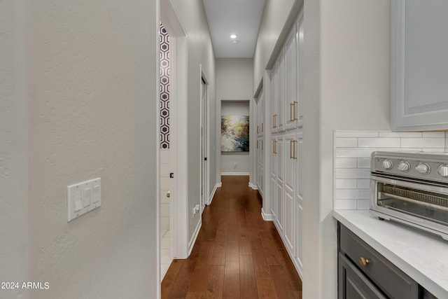 hallway with dark hardwood / wood-style floors