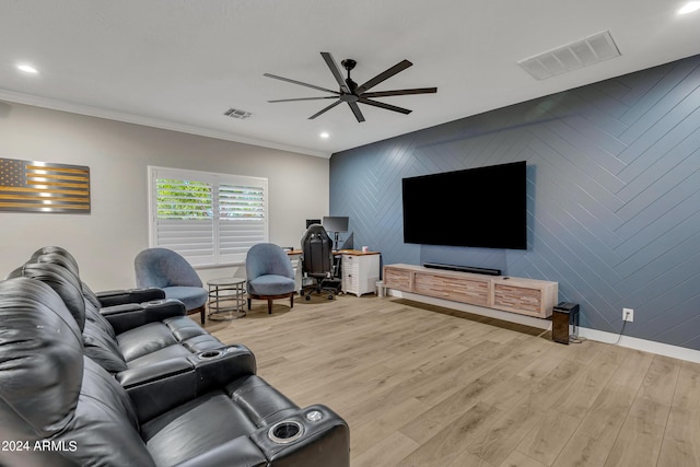 living room featuring light wood-type flooring, ceiling fan, and ornamental molding