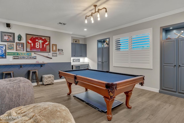 playroom featuring billiards, light hardwood / wood-style floors, and ornamental molding