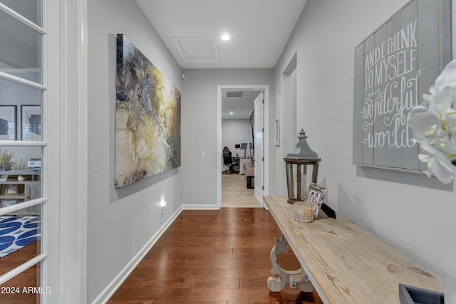 corridor with dark hardwood / wood-style floors