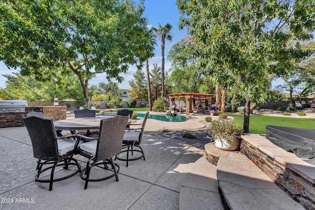 view of patio / terrace with grilling area and exterior kitchen