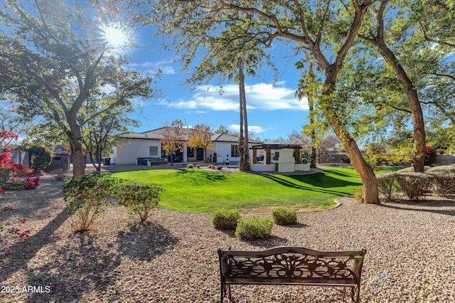 rear view of house with a lawn