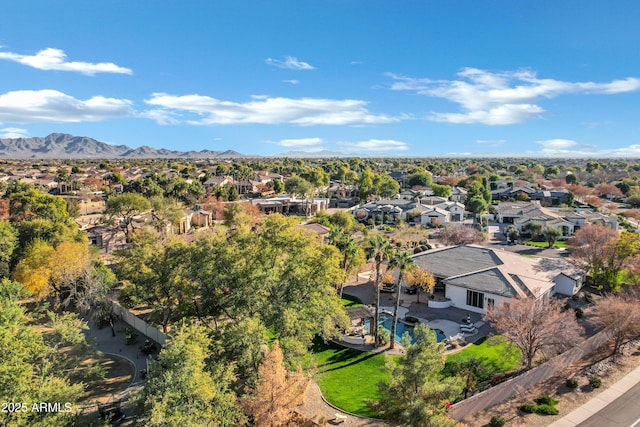 birds eye view of property featuring a mountain view