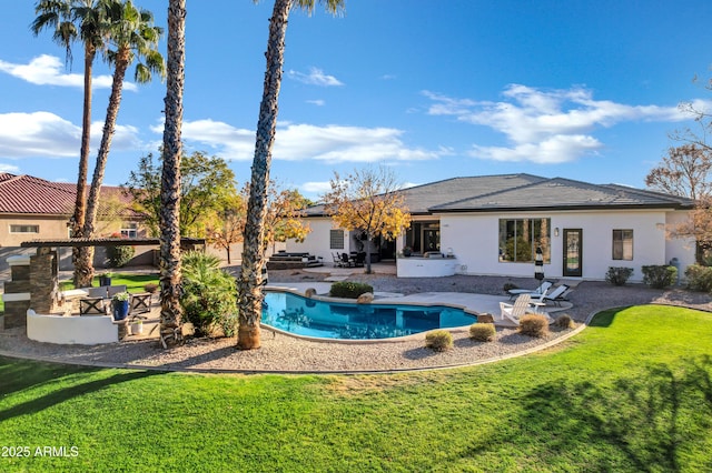 view of pool with a yard and a patio