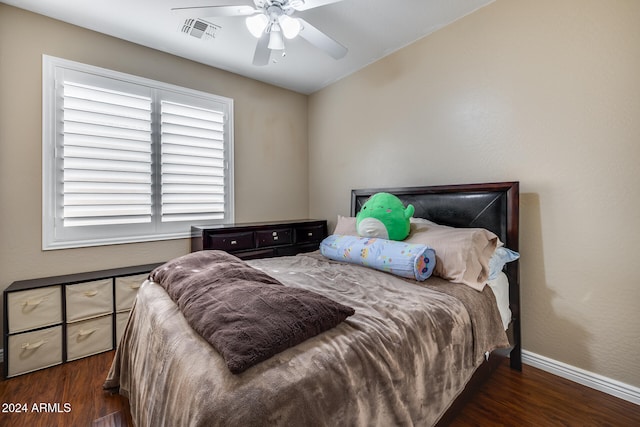 bedroom with ceiling fan and dark hardwood / wood-style floors