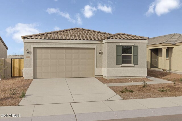 mediterranean / spanish-style house featuring a garage