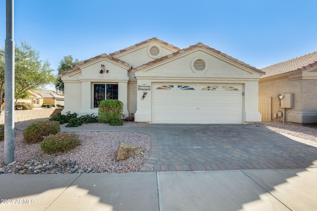 view of front of property featuring a garage