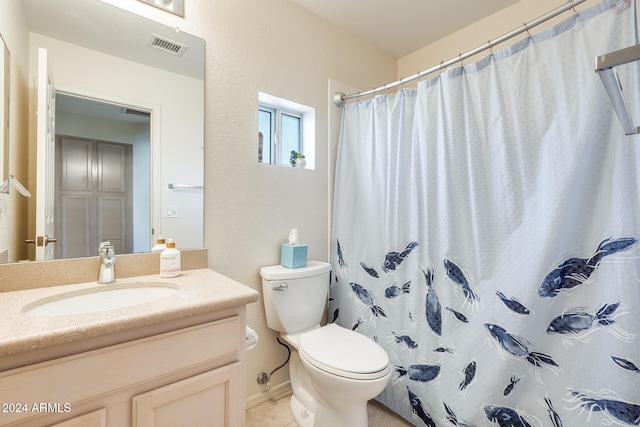 bathroom with walk in shower, vanity, and toilet