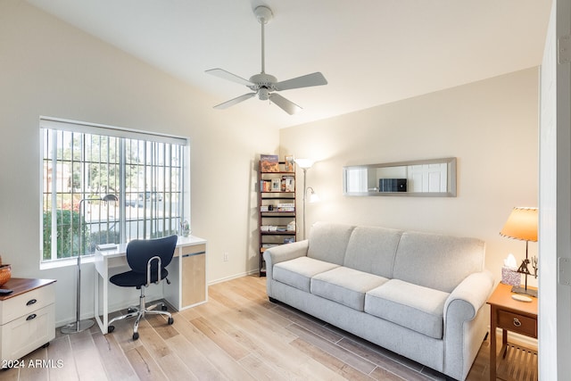 office with vaulted ceiling, ceiling fan, light hardwood / wood-style flooring, and plenty of natural light