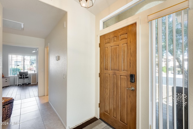 entryway featuring light tile patterned floors