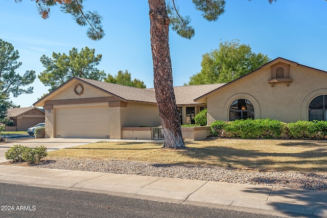 ranch-style home with a garage