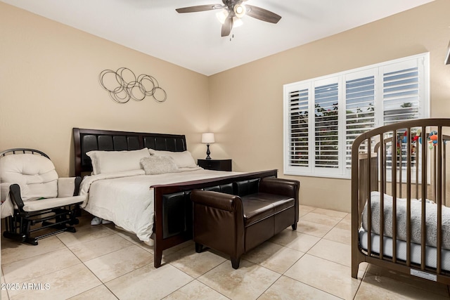 bedroom featuring ceiling fan and light tile patterned floors