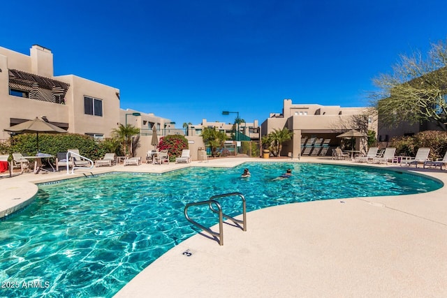 view of swimming pool with a patio area