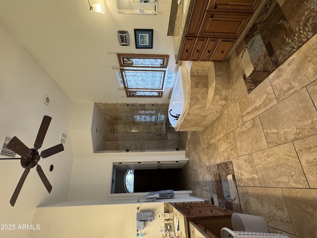 bathroom with tile walls