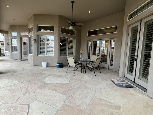 view of patio / terrace featuring ceiling fan