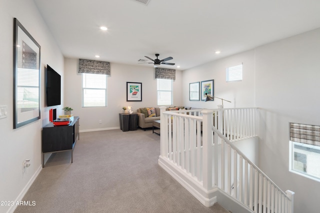 hall with recessed lighting, baseboards, carpet flooring, and an upstairs landing