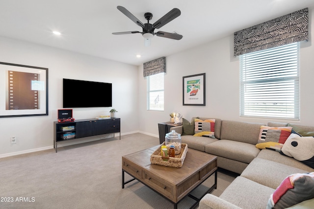 living room with ceiling fan, recessed lighting, baseboards, and light colored carpet