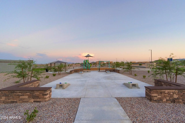 patio terrace at dusk featuring playground community