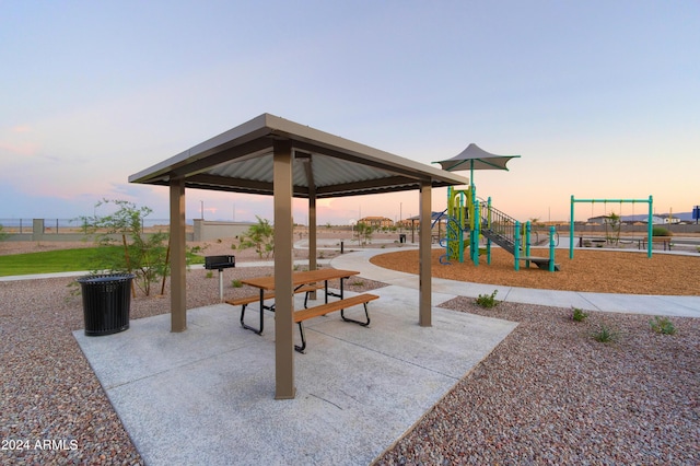 playground at dusk featuring playground community and a gazebo