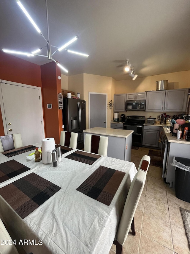 dining space featuring light tile patterned floors