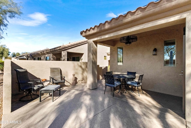 view of patio / terrace featuring outdoor dining space and fence