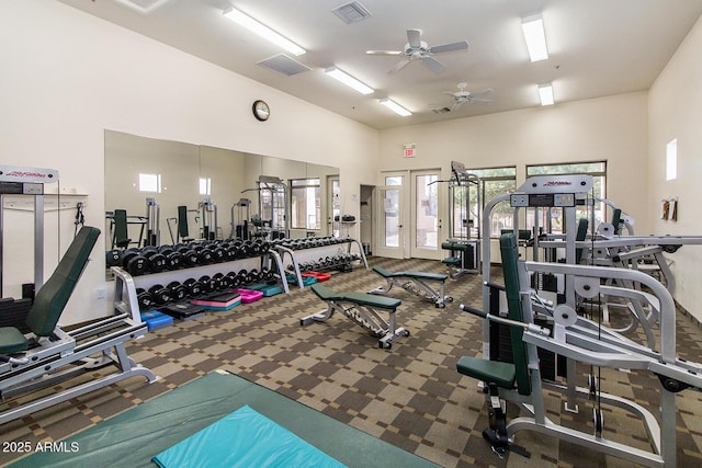 workout area with high vaulted ceiling, visible vents, ceiling fan, and carpet floors