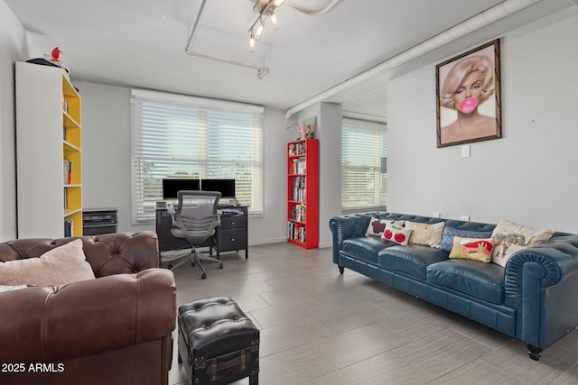 living room featuring rail lighting