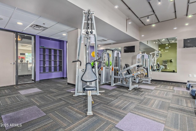 gym featuring dark colored carpet