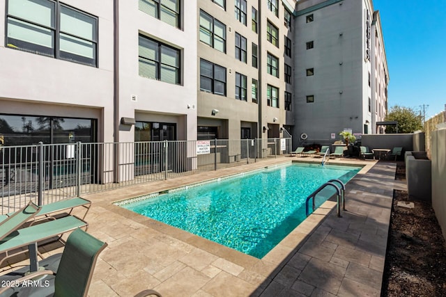 view of swimming pool with a patio area