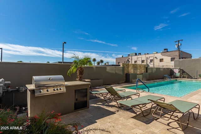 view of pool featuring a patio, grilling area, and area for grilling