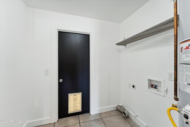 laundry room with hookup for a washing machine, hookup for an electric dryer, and light tile patterned floors