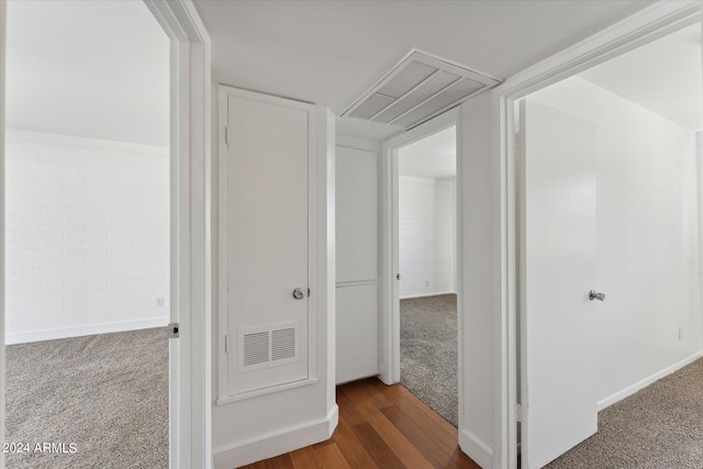 corridor featuring dark hardwood / wood-style flooring