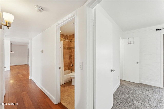 corridor featuring hardwood / wood-style floors