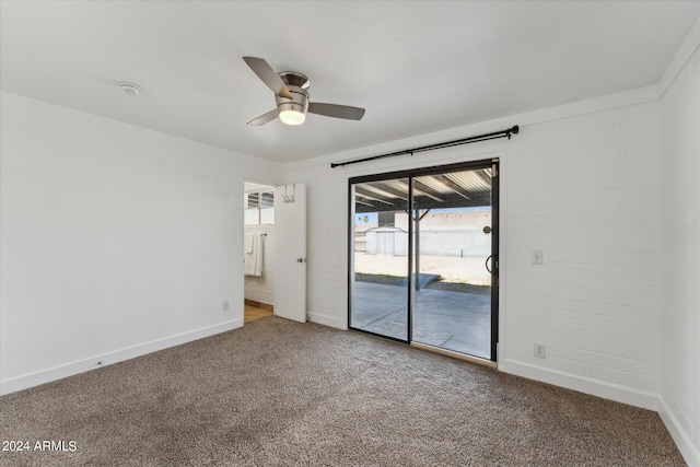 empty room featuring ceiling fan and carpet floors