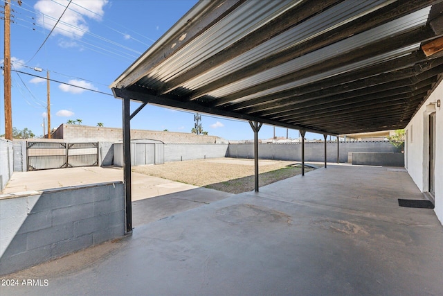 view of patio / terrace featuring a shed