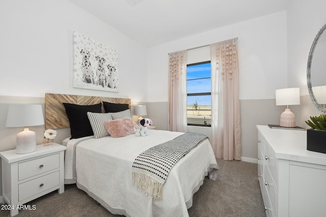 bedroom featuring dark colored carpet