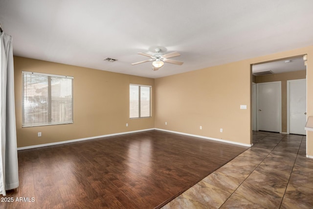 1403 W Goldfinch Way, Chandler, AZ 85286 - empty room with ceiling fan and wood finished floors