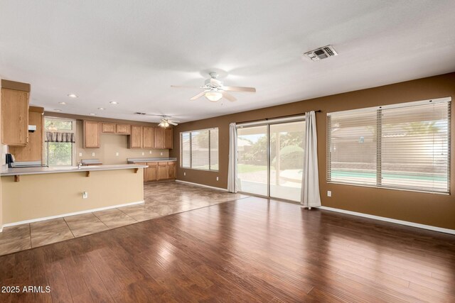 1403 W Goldfinch Way, Chandler, AZ 85286 - unfurnished living room with a ceiling fan, wood finished floors, and recessed lighting