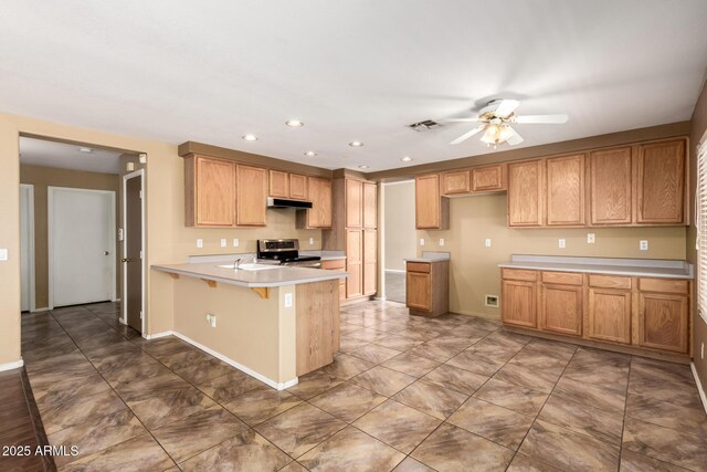1403 W Goldfinch Way, Chandler, AZ 85286 - kitchen featuring stainless steel electric range, a peninsula, under cabinet range hood, ceiling fan, and light countertops