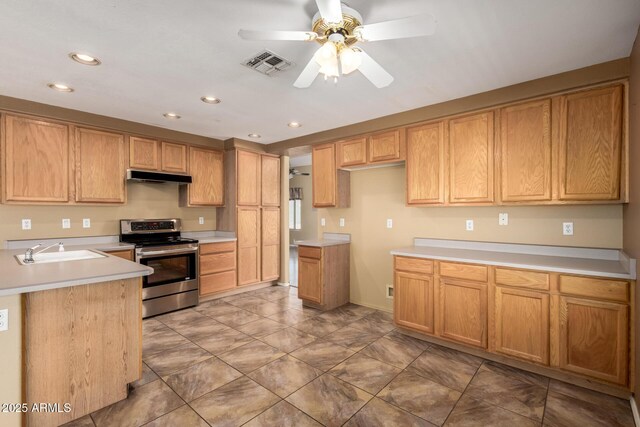 1403 W Goldfinch Way, Chandler, AZ 85286 - kitchen with stainless steel electric range oven, under cabinet range hood, ceiling fan, recessed lighting, and light countertops