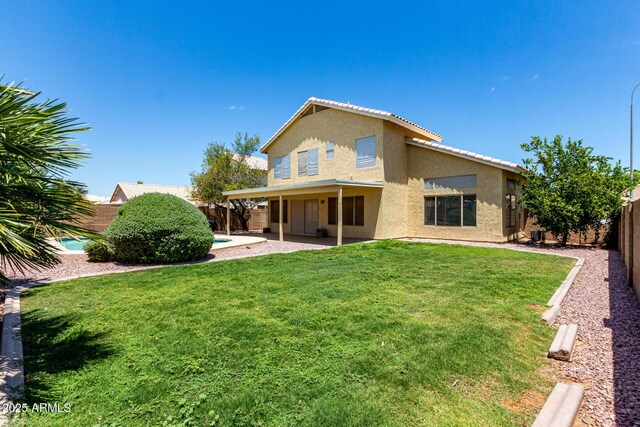 1403 W Goldfinch Way, Chandler, AZ 85286 - back of property with stucco siding, a fenced backyard, a patio area, and a tiled roof