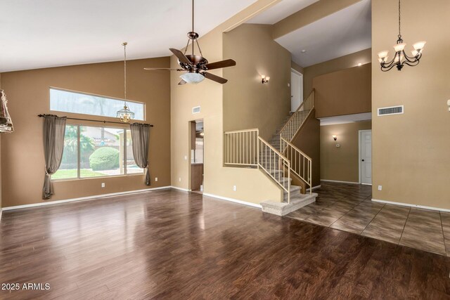 1403 W Goldfinch Way, Chandler, AZ 85286 - unfurnished living room featuring a chandelier, a ceiling fan, high vaulted ceiling, wood finished floors, and stairs