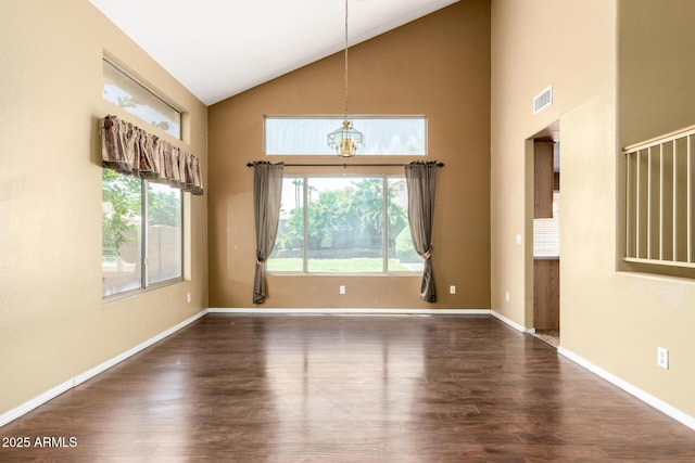1403 W Goldfinch Way, Chandler, AZ 85286 - unfurnished dining area with high vaulted ceiling, dark wood-style flooring, and a chandelier