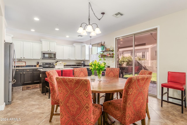 tiled dining room featuring a notable chandelier